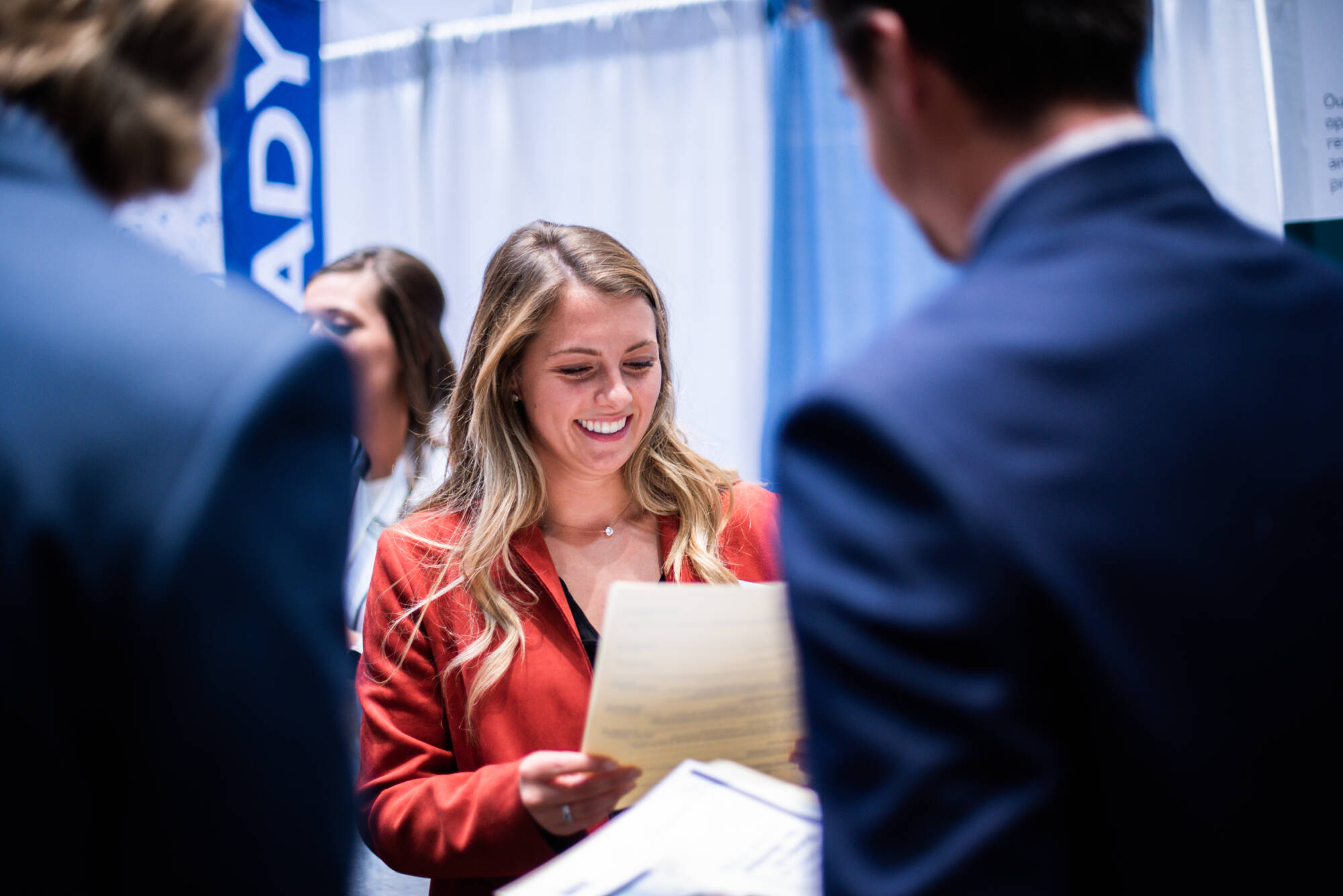 Student smiling at career fair.
